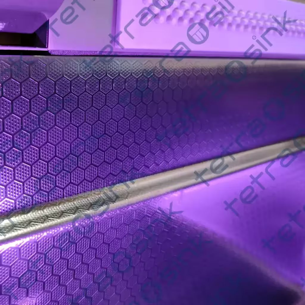 Close-up of a purple Multifunctional sink tetrasink waterfall kitchen sink best modern kitchen sink with 3d textured surface and 'tetrasink' branding.