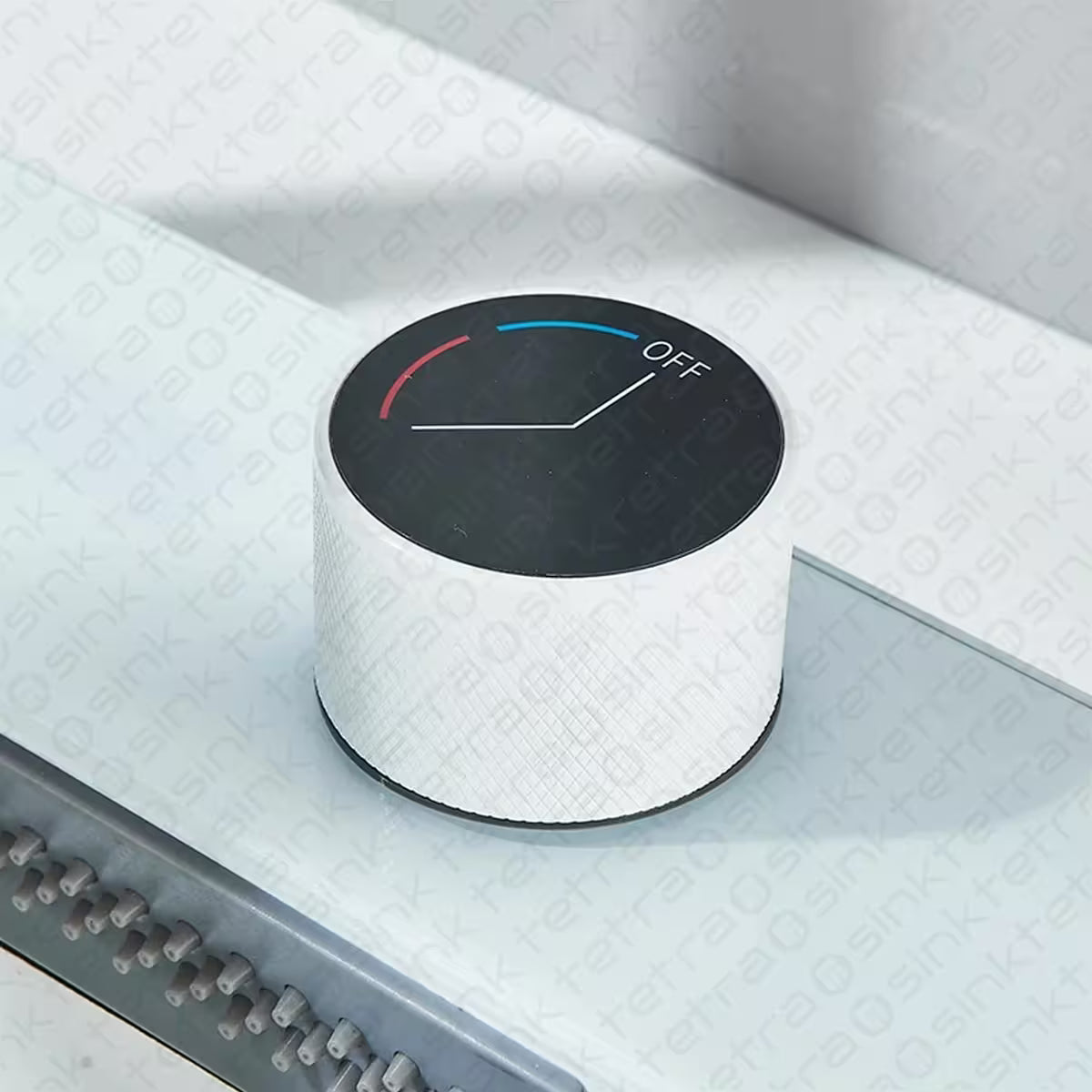 Control knob with 'Off' position on a Tetrasink multifunctional sink white kitchen sink textured surface