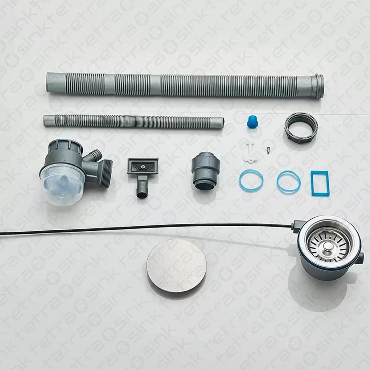 Set of plumbing components on a textured white surface
